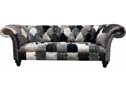 Luxuriéis Samettsofa am Chesterfield-Design mat faarwege Karos