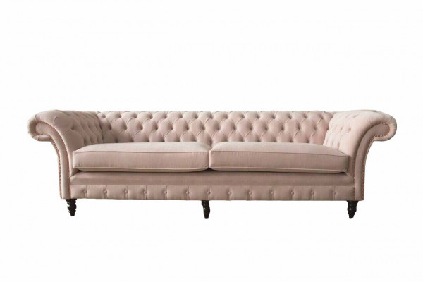 Eng luxuriéis, rosa véiersëtzeger Canapé am Chesterfield-Design, inklusiv Sëtzkëssen.
