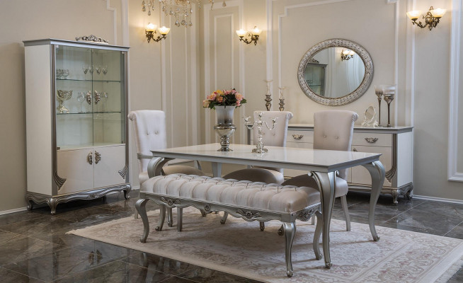 Wäiss Kommode mat praktesche Schëfferen an eleganten Regaler.