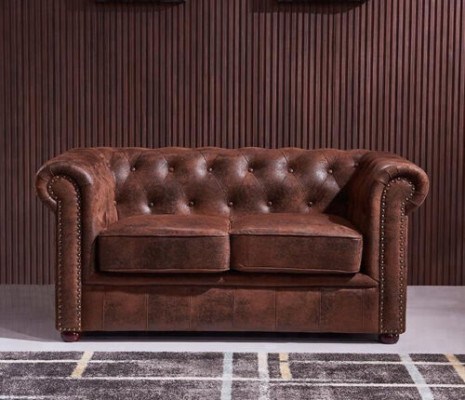 Luxuriéist Chesterfield-Sofa aus Kënschtlieder fir d'Wunnzëmmer