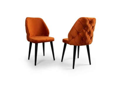 Gepolsterte Holzstull orange Chesterfield op schwaarze Been d'Iesszëmmer