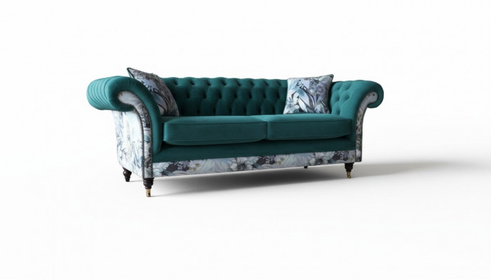 Een liewegt Tressëtz-Sofa aus Chesterfield an engem zarten Smaragdgréng mat Blummenmuster.